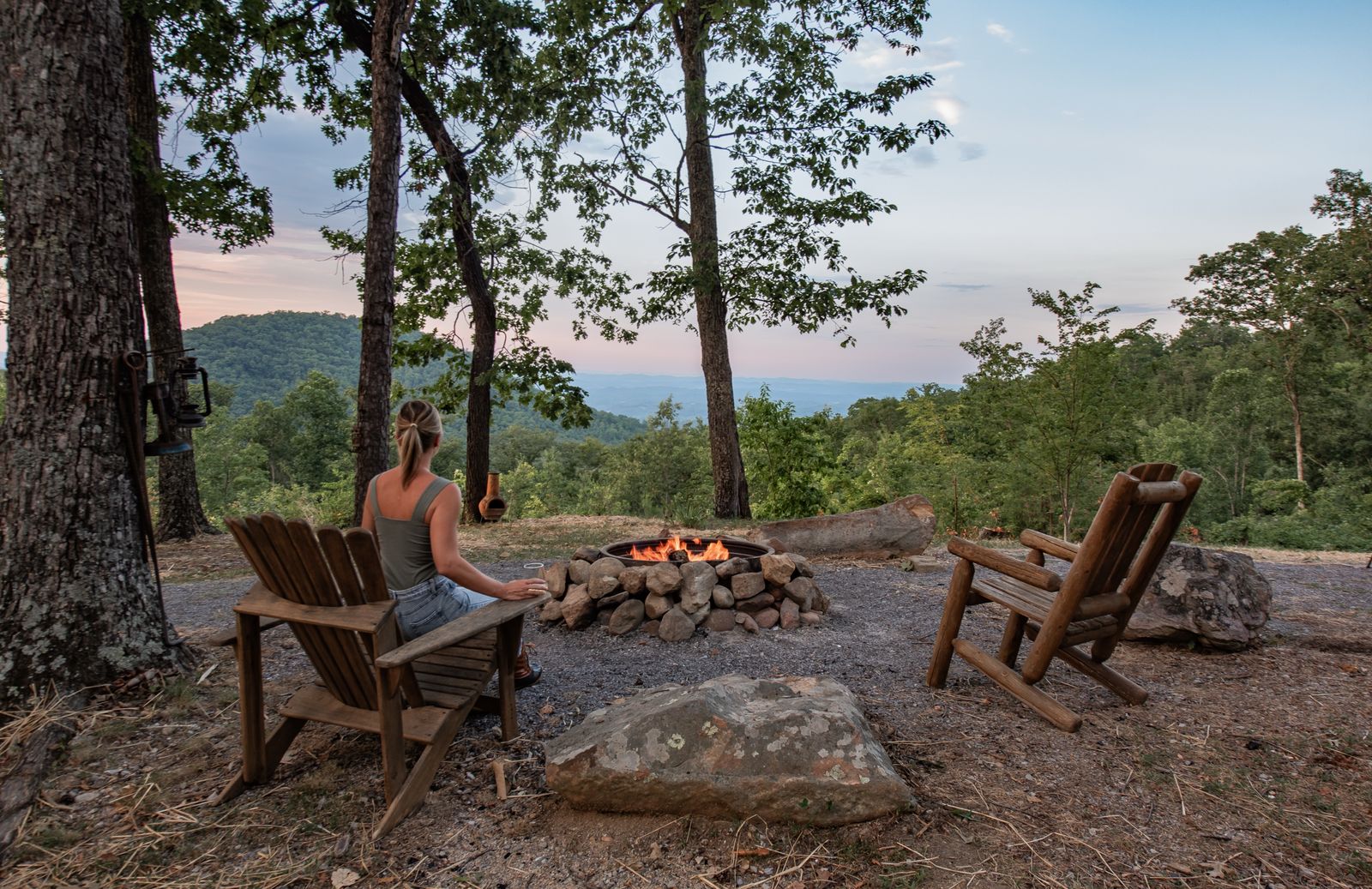 Guest enjoying the mountain view from the fire pit